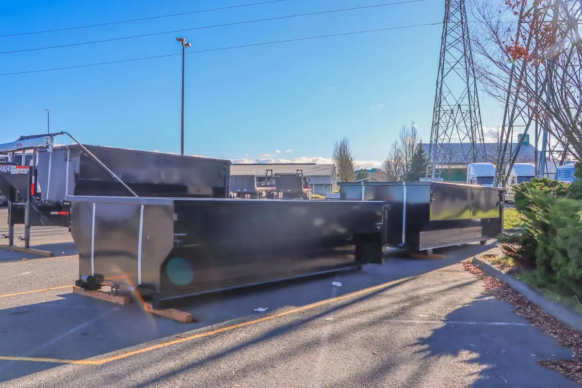 Roll-off dumpster ready for waste disposal at job site for 2 Yard Dumpster Rental in Fairwood